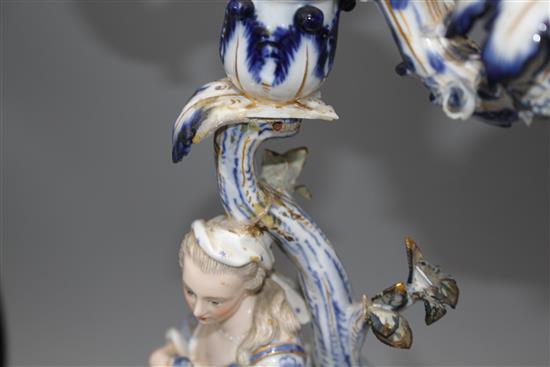A pair of Meissen porcelain candelabra, modelled with lady and gallant stems, height 46cm